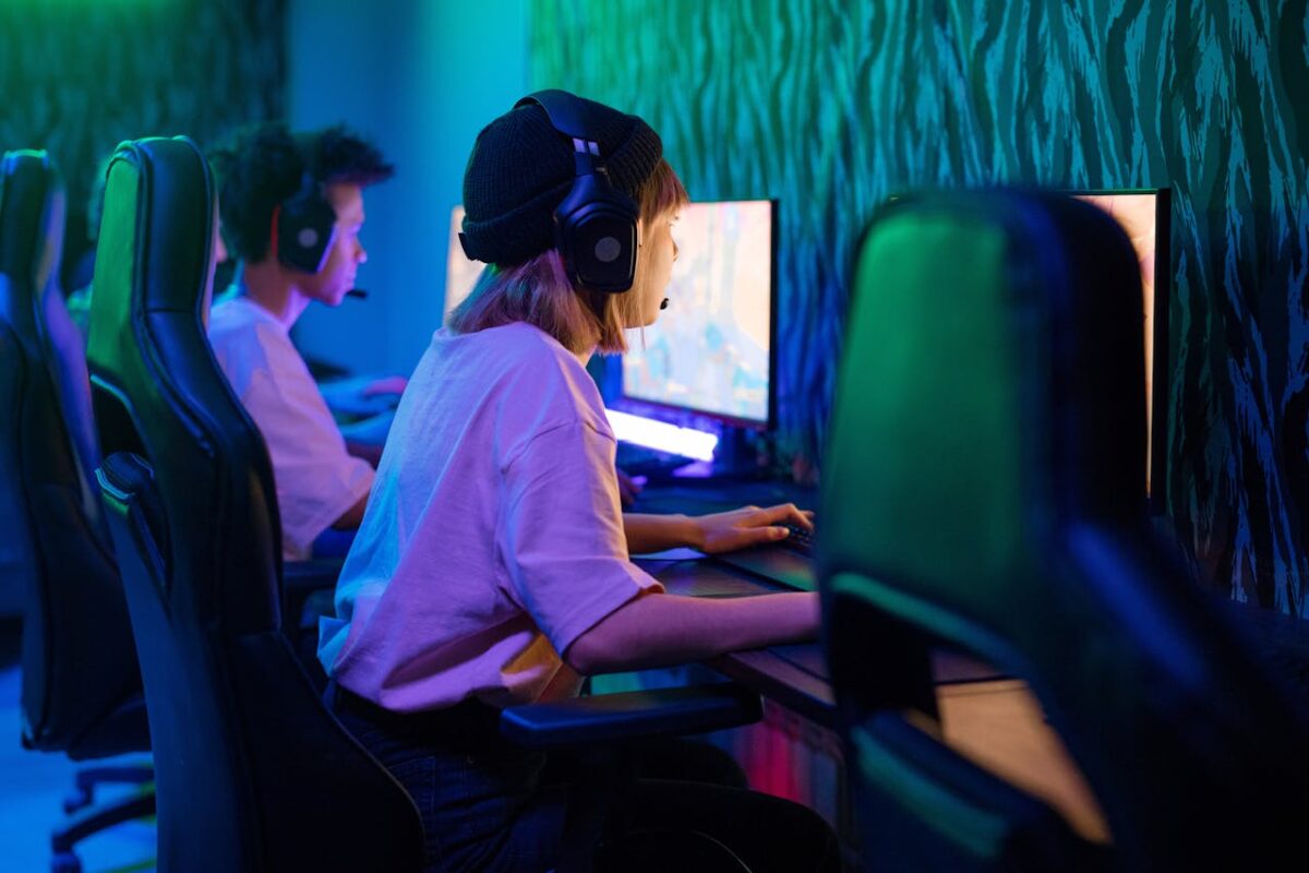 Young gamers deeply focused on an intense gaming session in a high-tech esports arena.